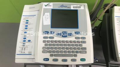 2 x Burdick Atria 6100 ECG Machines on Stands with 2 x 10-Lead ECG Leads (Both Power Up) * SN A6100-001698 / A6100-004165 * - 2