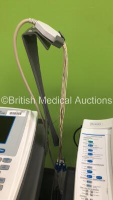 2 x Burdick Atria 6100 ECG Machines on Stands with 2 x 10-Lead ECG Leads (Both Power Up) * SN A6100-001698 / A6100-004165 * - 5