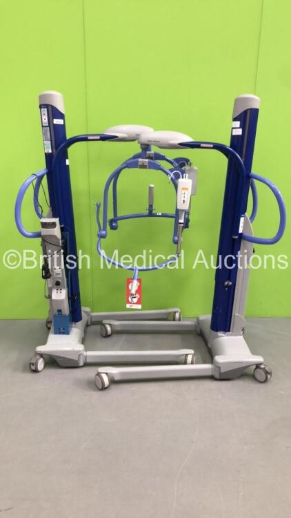 2 x Arjo Maxi Move Electric Patient Hoists with Controllers and Battery Charger (Both Power Up)