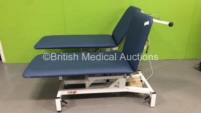 2 x Medi Plinth Electric Patient Couches with 2 x Controller (Both Power Up - Wheel Locking Mech Broken) *S/N 54900 / 503080*