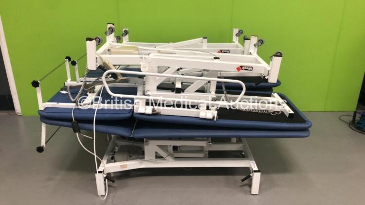 4 x Medi-Plinth Electric Patient Examination Couches with 2 x Controllers (2 x Power Up - 1 x Missing Electric RAM)