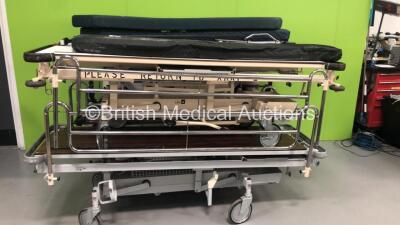 2 x Stryker 1037 Trauma Stretchers with Mattresses (Hydraulics Tested Working), 1 x Hoskins Hydraulic Patient Trolley with Mattresses (Hydraulics Tested Working) and 1 x Huntleigh Nesbit Evans Hydraulic Patient Trolley (Hydraulic Tested Working)