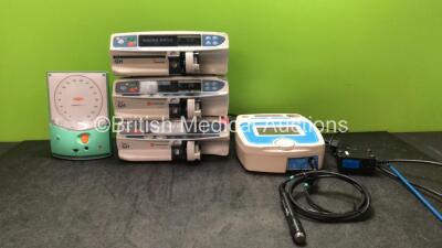 Mixed Lot Including 1 x Accoson Greenlight 300 Meter, 1 x Cardinal Health Alaris GH Syringe Pump (Powers Up with Service Message) 2 x CareFusion Alaris GH Syringe Pumps (Both Power Up, 1 with Fault-See Photo) 1 x EMS Primo Therasonic 460 Unit with 1 x AC 