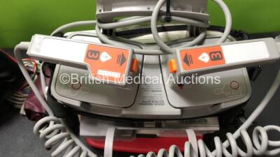 2 x Philips MRx Defibrillators Including Pacer, ECG, SpO2, NIBP and Printer Options with 1 x 3 Lead ECG Lead, 1 x SpO2 Finger Sensor, 1 x NIBP Hose, 1 x BP Cuff, 2 x Philips M3539A Batteries, 2 x M3538A Batteries, 2 x Hard Paddles, 2 x Printer Paper Reels - 9