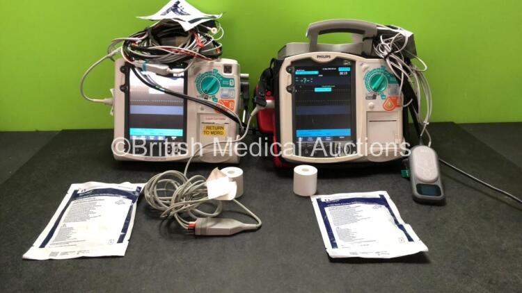 2 x Philips MRx Defibrillators Including Pacer, ECG, SpO2, NIBP and Printer Options with 2 x 3 Lead ECG Leads, 2 x Laerdal CPR Meters, 2 x Electrode Pads, 1 x Hard Paddle Mounting Bracket, 2 x Philips M3539A Batteries, 2 x M3538A Batteries and 4 x Covidie