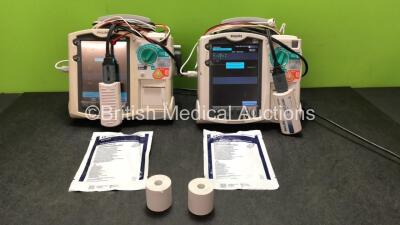 2 x Philips MRx Defibrillators Including Pacer, ECG and Printer Options with 2 x Paddle Lead, 2 x 3 Lead ECG Leads, 2 x Philips M3725A Test Loads, 2 x Philips M3539A Batteries and 2 x M3538A Batteries (Both Power Up)