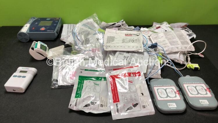 Mixed Lot Including 1 x Laerdal Heartstart FR2 Defibrillator (No Power when Tested with Stock Battery-Battery Not Included) 1 x Welch Allyn Ref 901050 Ambulatory Blood Pressure Monitor (No Power) 1 x Living Science Digital Blood Pressure Monitor (Powers U