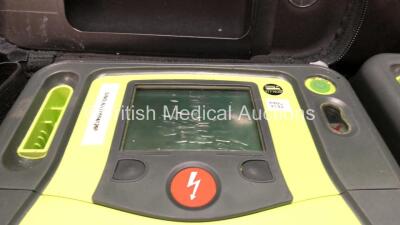 4 x Zoll AED Pro Defibrillators with 1 x Electrodes, 1 x 3 Lead ECG Lead and 4 x Batteries in Carry Case (All Power Up 2 with Damaged Screens-See Photos ) - 4