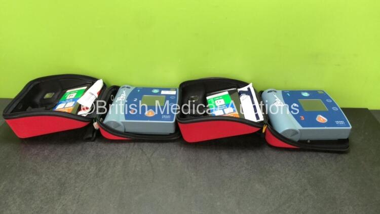 2 x Philips FR2+ Defibrillators in Carry Case (Both Power Up and Pass Self Tests- Batteries Not Included)