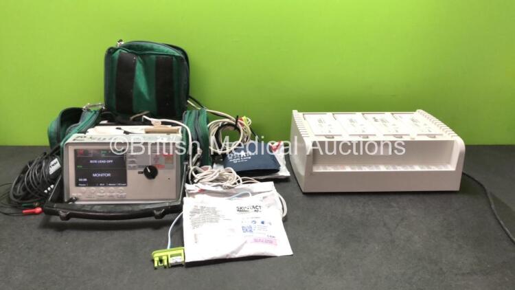 Job Lot Including 1 x Zoll E Series Defibrillator with 1 x SpO2 Leads, 1 x SpO2 Finger Sensor, 1 x ECG Leads, 1 x NIBP Lead, 1 x BP Cuff and 1 x Battery (Powers Up) 1 x Zoll Sure Power Battery Charger with 4 x Batteries (Powers Up) 3 x Electrode Paddles