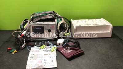 Job Lot Including 1 x Zoll E Series Defibrillator with 1 x SpO2 Leads, 1 x SpO2 Finger Sensor, 1 x ECG Leads, 1 x NIBP Lead, 1 x BP Cuff, 1 x Zoll Lo Flo Module and 1 x Battery (Powers Up) 1 x Zoll Sure Power Battery Charger with 4 x Batteries (Powers Up)