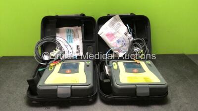 2 x Zoll AED Pro Defibrillators with 2 x 3 Lead ECG Leads and 2 x Electrodes in Carry Cases (Both Power Up)