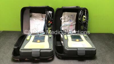 2 x Zoll AED Pro Defibrillators with 2 x 3 Lead ECG Leads and 2 x Electrodes in Carry Cases (Both Power Up)