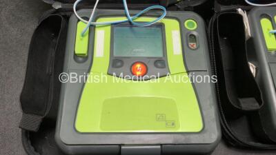 2 x Zoll AED Pro Defibrillators with 2 x 3 Lead ECG Leads and 2 x Electrodes in Carry Cases (Both Power Up) - 2