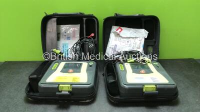 2 x Zoll AED Pro Defibrillators with 2 x 3 Lead ECG Leads and 2 x Electrodes in Carry Cases (Both Power Up)