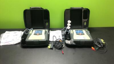 2 x Zoll AED Pro Defibrillators with 2 x 3 Lead ECG Leads and 2 x Electrodes in Carry Cases (Both Power Up)