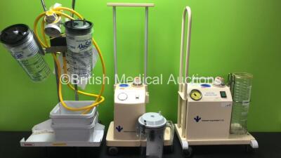 2 x Electric Suction Units on 3 x Wheeled Trolleys, 4 x Canisters and 1 x Hose