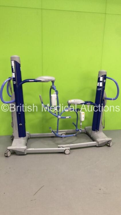 2 x Arjo Maxi Move Electric Patient Hoists with 2 x Controllers (1 x Powers Up,1 x Unable to Test Due to No Battery)