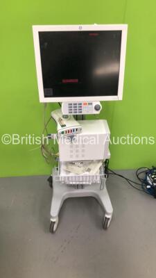 GE CDA19T Patient Monitor (Damage to Surround) on Stand with GE TRAM-RAC 4A Module Rack with Capnostat Mainstream CO2 Module, GE Solar 8000i Dual Video Control Unit and GE Patient Data Module Ref 2016793-003 with ECG, Temp/CO, P1/3, P2/4, SPO2 and NIBP Op