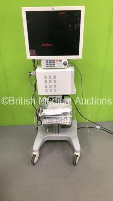 GE CDA19T Patient Monitor on Stand with GE TRAM-RAC 4A Module Rack with Capnostat Mainstream CO2 Module, GE Solar 8000i Dual Video Control Unit and GE Patient Data Module Ref 2016793-003 with ECG, Temp/CO, P1/3, P2/4, SPO2 and ECG Options (Powers Up)