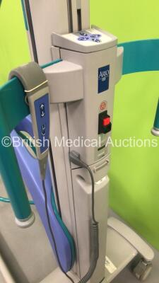 1 x Minstrel Electric Patient Hoist with Controller (Not Power Tested Due to No Battery) and 1 x Arjo Opera Electric Patient Hoist with Battery and Controller (No Power) - 5