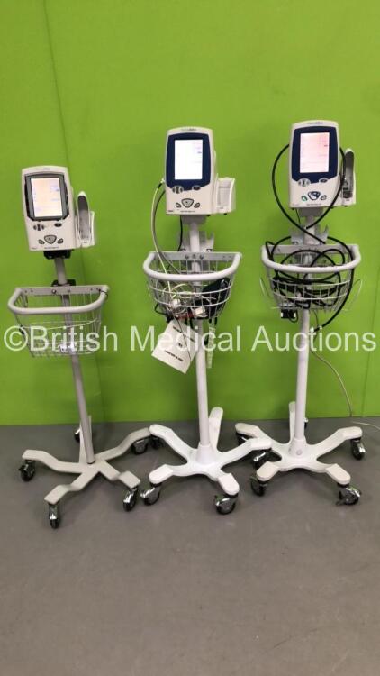 3 x Welch Allyn Spot Vital Signs LXi Patient Monitors on Stands with 3 x BP Hoses and 1 x SpO2 Finger Sensor (All Power Up-1 x Missing Plastic Trim-See Photos)