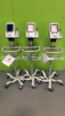 3 x Welch Allyn Spot Vital Signs LXi Patient Monitors on Stands (2 x Power Up-,1 x No Power-3 x Missing Plastic Trims-See Photos)