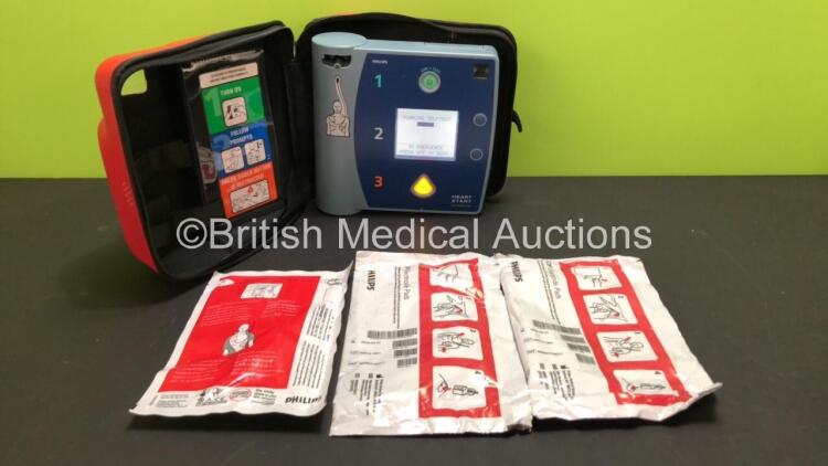 Philips HeartStart FR2+ Defibrillator with 1 x Battery (Install By - 11/2024) 2 x Philips DP Electrode pads *Expiry Dates 03/2022 and 03/2022* and 1 x Philips Peel and Stick Pads *Expiry 02/2009* in Case (Powers Up and Passes Self Test)