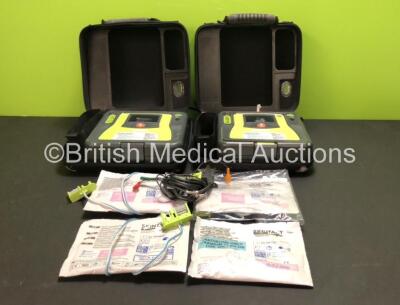 2 x Zoll AED Pro Defibrillators with 1 x ECG Lead, 2 x Batteries, 4 x Skintact Electrodes *1 Expires 10/2023, 3 Expiry* in Carry Cases (Both Power Up with Slight Damage to Screens and Casing, See Pictures)