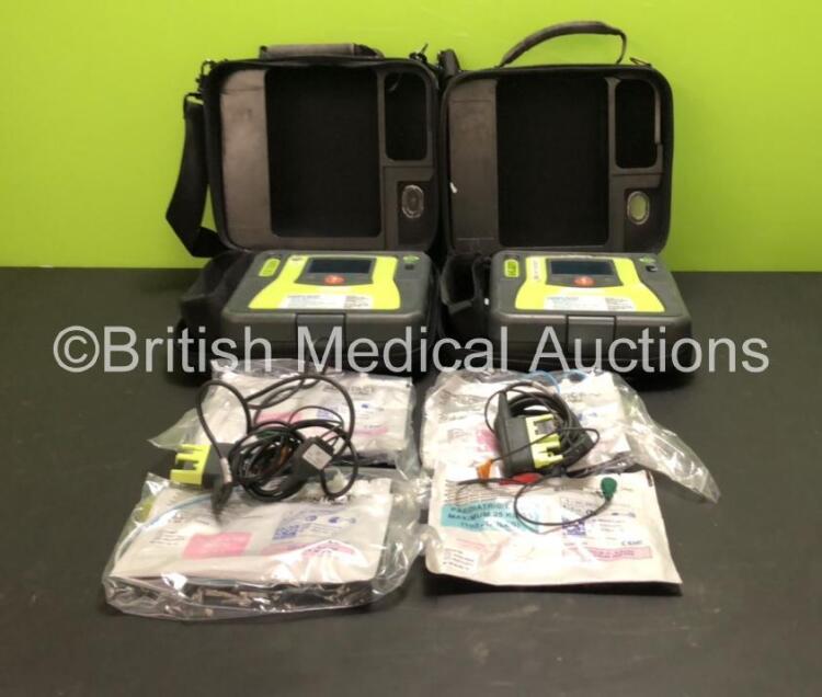 2 x Zoll AED Pro Defibrillators with 2 x ECG Leads, 2 x Batteries (1 x Good Battery and 1 x Flat Battery Included), 4 x Skintact Electrodes *All Expiry* in Carry Cases (Both Power Up with Good Batteries, 1 x Good and 1 x Flat Battery Included)