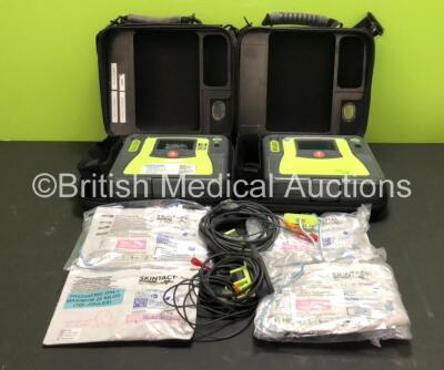 2 x Zoll AED Pro Defibrillators with 2 x ECG Leads, 2 x Batteries (2 x Flat Battery Included), 4 x Skintact Electrodes *Expiry Dates 02/2024, 02/2022, 10/2023 and 10/2023*, in Carry Cases (Both Power Up, 1 With Slight Damage to Screen, 2 x Flat Batteries 