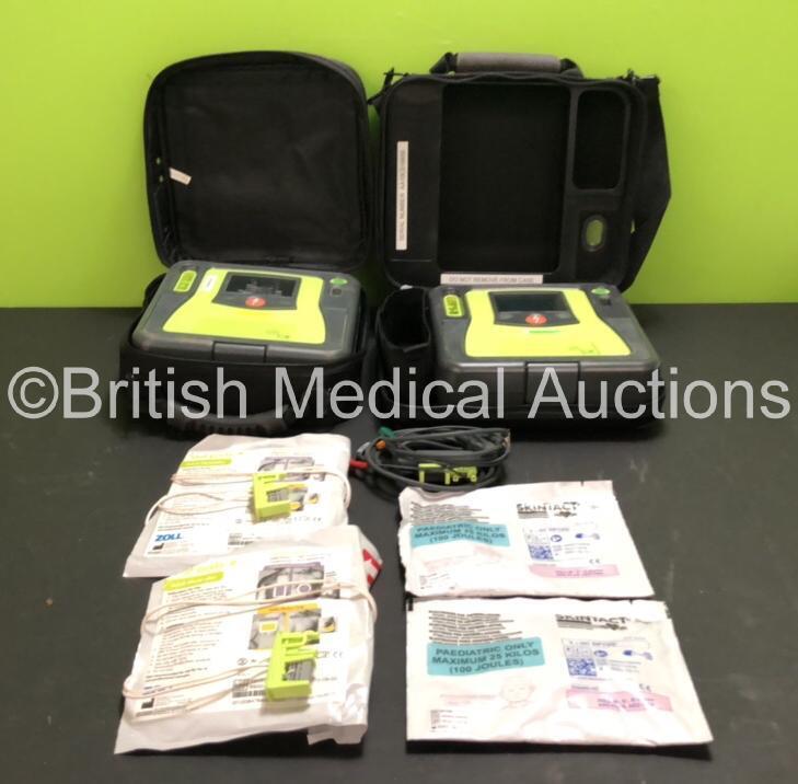 2 x Zoll AED Pro Defibrillators with 1 x ECG Lead, 2 x Batteries (2 x Flat Battery Included), 2 x Skintact Electrodes and 2 x Stat-Padz Electrodes *All Expiry*, in Carry Cases (Both Power Up, 1 With Slight Damage to Screen, 2 x Flat Batteries Included)