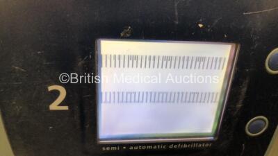 Job Lot Including 1 x Laerdal Heartstart FR2 Defibrillator (Powers Up with Faulty Screen) and 1 x Agilent HeartStream FR2 Defibrillator (No Power) with 2 x Batteries Install By - 10/2018 and 9/2026 - 4