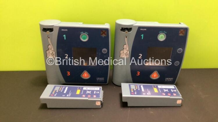 2 x Philips Heartstart FR2+ Defibrillators with 2 x Batteries Install By - 10/2023 and 2/2022 (Both Power Up in French Display, 2 Low Batteries Included)