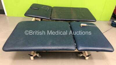 1 x Akron Bariatric Hydraulic Patient Examination Couch * Damage to Cushion-See Photos * and 1 x Hoskins Electric Bariatric Patient Examination Couch with Controller (Hydraulics Tested Working,Powers Up and Tested Working)