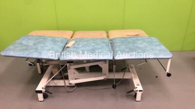 1 x Medi Plinth Electric 3 Way Patient Examination Couch with Controller (Powers Up) and 1 x Huntleigh Nesbit Evans Hydraulic Patient Examination Couch (Hydraulics Tested Working) *S/N 28884276*