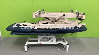 1 x Medi Plinth Electric Patient Examination Couch with Controller (Powers Up - Rips to Cushions) and 1 x Hoskins Hydraulic Patient Examination Couch with Controller (Powers Up - Cuts to Cushions) *S/N 1817776*