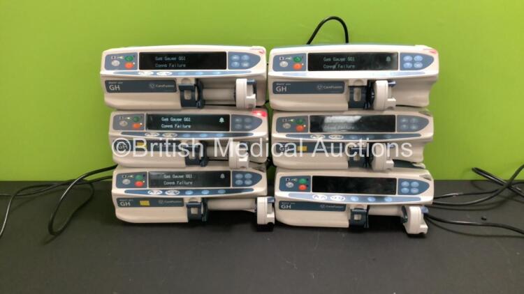 6 x Carefusion Alaris GH Plus Syringe Pumps (5 x Power Up with Gas Gauge GG1 Comms Failure, 1 x Draws Power, Unable to Tell if Powers Up Due to Damaged Screen - See Photo)