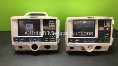 2 x Lifepak 20 Defibrillators with Pacer, ECG and Printer Options (Both Power Up - 1 x Service Light, 1 x Missing Dial and 1 x Missing Handle, See Photos)