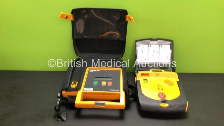 1 x Medtronic Lifepak 500 Biphasic Automated External Defibrillator in Carry Case (No Power - Possible Flat Battery) and 1 x Medtronic Lifepak CR Plus Defibrillator (Powers Up)