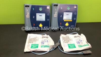 2 x Laerdal HeartStart FR2+ Defibrillators with 2 x Batteries *Install Dates 03-2023 / 06-2025* and 2 x Electrode Packs - Out of Date (Both Power Up and Pass Self Test) *1207267232 / 1007258805*