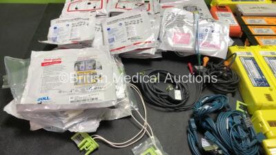 Mixed Lot Including 2 x 3 Lead ECG Leads, 5 x Covidien Mon-a Therm SpO2 Connection Cables, Various Defibrillation Electrodes *Some In Date, Some Expired* Various Defibrillator Batteries *All Untested* - 2