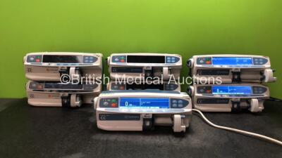 Job Lot Including 3 x Carefusion Alaris CC Syringe Pumps (2 Powers Up, 1 Holds Power with Blank Display Screen-See Photo) 1 x Carefusion Alaris Plus CC Syringe Pump (Power Up) 3 x Carefusion Alaris CC Guardrails Plus Syringe Pumps (All Power Up)