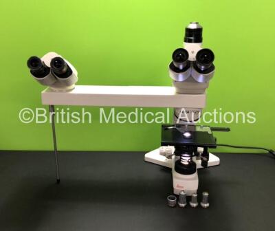 Leica DMLS Type 020-518.500 Bench Microscope with 4 x HC Plan 10x/20 Eyepieces, 4 x Leica Optics Including 1 x C Plan 4x/0,10, 1 x C Plan 40x/0.65, 1 x C Plan 20x/0.40 and 1 x C Plan 10x/0.22, 1 x C-Mount 1x Attachment and Leica 505073 Teaching Arm (Power