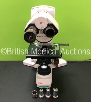 Leica DMLS Type 020-518.500 Bench Microscope with 1 x HC Plan 10x/20 Eyepiece and 4 x Leica Optics Including 1 x C Plan 4x/0,10, 1 x C Plan 40x/0.65 PH2, 1 x C Plan 20x/0.40 and 1 x C Plan 10x/0.22 (Powers Up with Good Bulb) *501095*