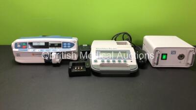 Mixed Lot Including 1 x CareFusion Alaris CC Syringe Pump, 1 x BladderScan BVI 300 with Probe Battery and Charger (Some Damaged Casing - See Photo) and 1 x RB Light Source (All Power Up) *800338249 / 02051754*