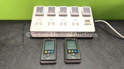 2 x Philips IntelliVue MX40 Patient Monitoring Systems Including ECG and SpO2 Options *Mfd 07/2012, 07/2014* with 1 x Philips Ref 865220 Battery Charger *Mfd 06/2014* 5 x Batteries (Powers Up, 1 Unit with Damaged Battery Cover-See Photo)