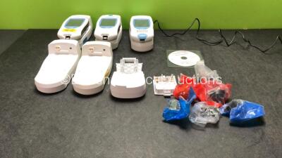 Job Lot Including 3 x Roche Coaguchek XS Plus Blood Monitoring Units with 5 x Handheld Base Units, 1 x AC Power Supply and 1 x Spare Battery Cover (All Power Up) *SN UU00012939, UU000109276, UU00024240, UU00032769, UU00031801,