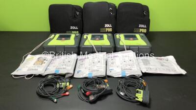 3 x Zoll AED Pro Defibrillators with 3 x Batteries, 3 x ECG Leads and 5 x Electrode Packs in Carry Cases (All Power Up, 1 x Slight Damage to Screen - See Photos) *AA06E002536, AA10C016643 and AA11A019525*