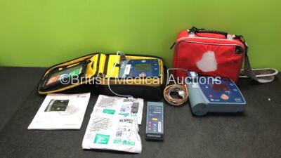 Job Lot Including 2 x Laerdal Heartstart FR2+ Defibrillators with 3 x Philips M3863A Batteries *Install Dates 09-2018, 02-2022, 10-2013 * 2 x Skintac Electrode Pads (Both Out of Date) 1 x 3 Lead ECG Lead, 1 x Instruction Manual and 2 x Carry Bags (Both Po